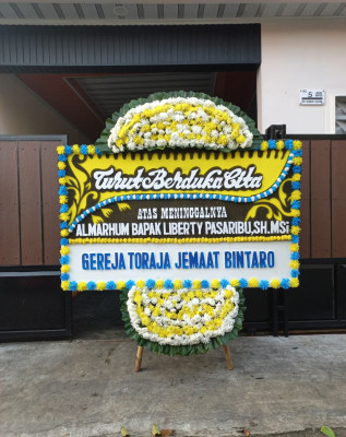 Papan Bunga Duka di Mudal
